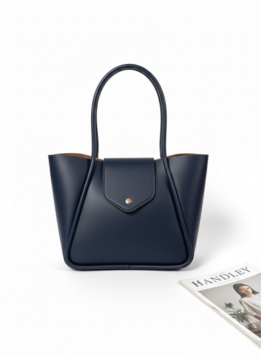 KAPAK DETATLI ŞIK TASARIMLI ELDEN TUTMALI ÇANTA